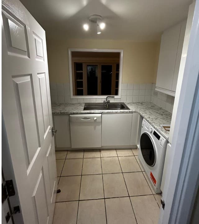 A dated London kitchen refitted with fresh units and stone-effect worktops — a real Haus project.